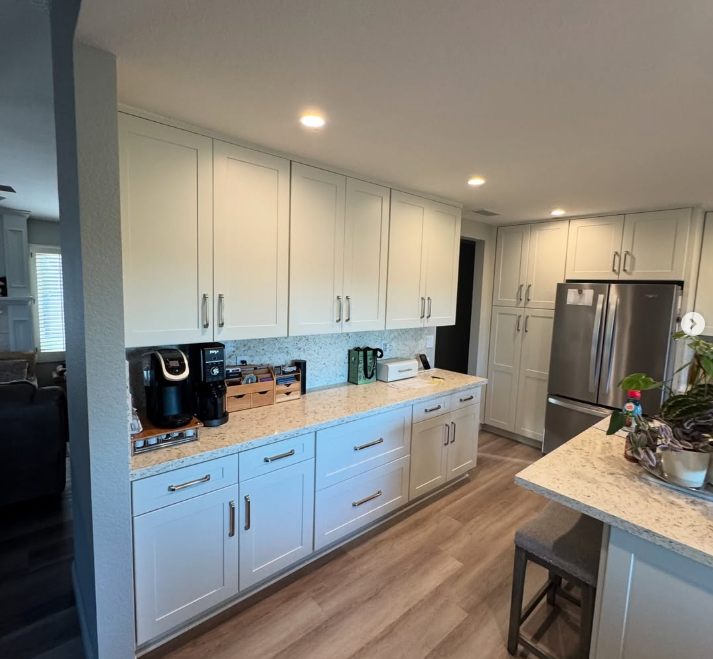 Sprayed white painted cabinets by Onyx GC
